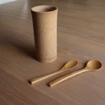 a bamboo glass and spoons